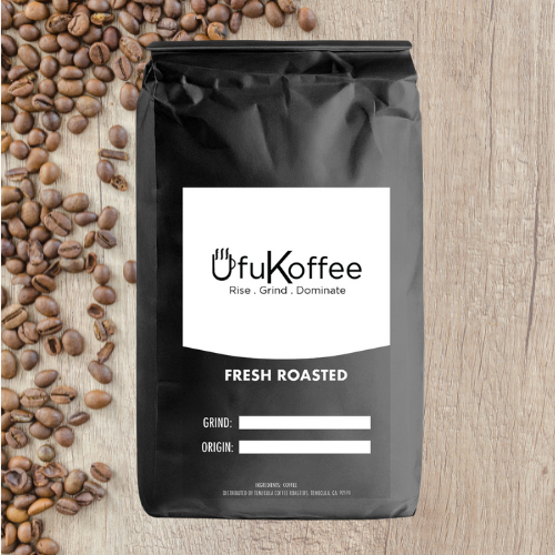 UfuKoffee black bag with freshly roasted Mexican coffee delivered alongside scattered coffee beans on wooden surface