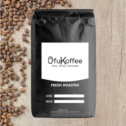 UfuKoffee black bag with freshly roasted Mexican coffee delivered alongside scattered coffee beans on wooden surface